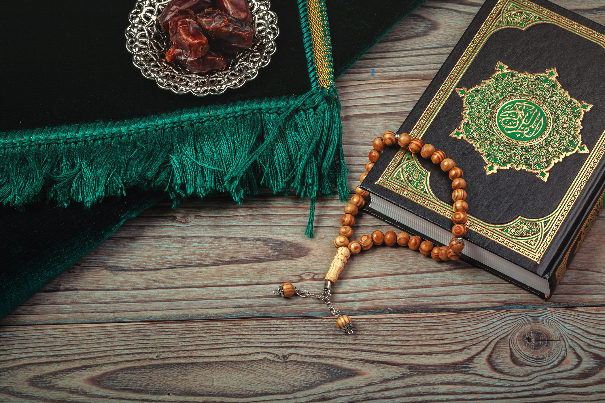 Table top decoration Ramadan Kareem holiday background of dates with  rosary & The holy book of Koran